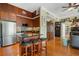 Open-concept kitchen featuring stainless steel appliances, granite countertops, and bar seating at 57 Forsyth St # 13D, Atlanta, GA 30303