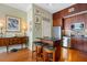 Modern kitchen with dark wood cabinets, stainless steel appliances, and an island with bar seating at 57 Forsyth St # 13D, Atlanta, GA 30303