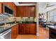 Updated kitchen featuring stainless steel appliances, mosaic tile backsplash, and dark wood cabinets at 57 Forsyth St # 13D, Atlanta, GA 30303