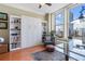 Living area featuring a murphy bed, shelving and large windows for city views and great light at 57 Forsyth St # 13D, Atlanta, GA 30303
