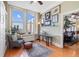Sun-filled living room with desk, shelving, and windows offering city views and natural light at 57 Forsyth St # 13D, Atlanta, GA 30303