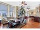 Bright living room with hardwood floors, large windows offering city views, and elegant furnishings at 57 Forsyth St # 13D, Atlanta, GA 30303