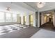 Elevator lobby with large windows and a vintage-style ceiling fixture at 57 Forsyth St # 13D, Atlanta, GA 30303