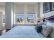 Well-lit main bedroom with large windows overlooking city views and a comfortable bed at 57 Forsyth St # 13D, Atlanta, GA 30303
