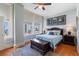 Bright main bedroom featuring large windows with city views, hardwood floors, and neutral decor at 57 Forsyth St # 13D, Atlanta, GA 30303
