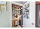 Pantry with shelving and storage systems, and a washer dryer combo, offering storage and convenience at 57 Forsyth St # 13D, Atlanta, GA 30303
