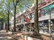 Charming street view with brick sidewalks, trees, and the Majestic Repairing building on a sunny day at 57 Forsyth St # 13D, Atlanta, GA 30303
