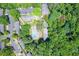 Aerial view showing the community pool, apartment buildings, parking, and surrounding lush green trees at 747 Houston Mill Ne Rd # 1, Atlanta, GA 30329