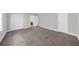 Spacious bedroom with neutral gray walls, plush carpet, walk-in closet, and ensuite bathroom entrance at 747 Houston Mill Ne Rd # 1, Atlanta, GA 30329