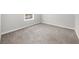 Well-lit bedroom with neutral gray walls and plush carpet, a blank canvas for personalized decor at 747 Houston Mill Ne Rd # 1, Atlanta, GA 30329