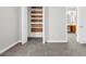 Large closet in bedroom with wire shelves, open doors and view to wooden desk and vanity in adjacent room at 747 Houston Mill Ne Rd # 1, Atlanta, GA 30329