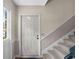 View of the front door with staircase and window to left at 747 Houston Mill Ne Rd # 1, Atlanta, GA 30329
