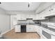 Kitchen featuring white cabinets, granite countertops, tile flooring and a black dishwasher at 747 Houston Mill Ne Rd # 1, Atlanta, GA 30329