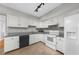 Updated kitchen with white appliances, granite countertops and a view into the dining area at 747 Houston Mill Ne Rd # 1, Atlanta, GA 30329