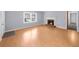 Living room featuring hardwood floors, a brick fireplace, freshly painted walls and bright window at 747 Houston Mill Ne Rd # 1, Atlanta, GA 30329