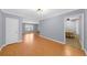 Open concept living and dining area with hardwood floors and modern lighting at 747 Houston Mill Ne Rd # 1, Atlanta, GA 30329