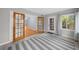 Bright living area featuring wood-framed glass doors, neutral paint, large windows and a striped rug at 747 Houston Mill Ne Rd # 1, Atlanta, GA 30329