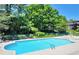 Community swimming pool with clear blue water, ladder access, and white lounge chairs for residents at 747 Houston Mill Ne Rd # 1, Atlanta, GA 30329