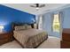 Primary bedroom with wooden furniture and a large window providing natural light at 10 Perimeter Summit Ne Blvd # 2112, Atlanta, GA 30319