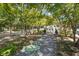 Landscaped courtyard with seating areas and walking paths under mature trees at 10 Perimeter Summit Ne Blvd # 2112, Atlanta, GA 30319