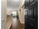 Inviting entryway with a view into the living area and a modern black door at 10 Perimeter Summit Ne Blvd # 2112, Atlanta, GA 30319