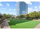 Features a modern building, expansive lawn area, and lush trees, providing a vibrant outdoor space at 10 Perimeter Summit Ne Blvd # 2112, Atlanta, GA 30319