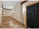 Hallway leads to a unit door, and a tiled floor extends into the distance at 10 Perimeter Summit Ne Blvd # 2112, Atlanta, GA 30319