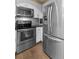 The modern kitchen includes stainless steel appliances and white cabinets at 10 Perimeter Summit Ne Blvd # 2112, Atlanta, GA 30319