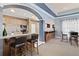 Amenity kitchen and bar area with stainless steel appliances and bar stool seating at 10 Perimeter Summit Ne Blvd # 2112, Atlanta, GA 30319