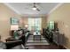 Comfortable living room features a ceiling fan and plenty of natural light at 10 Perimeter Summit Ne Blvd # 2112, Atlanta, GA 30319