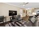 This cozy living room provides a relaxing space with access to the kitchen and other areas at 10 Perimeter Summit Ne Blvd # 2112, Atlanta, GA 30319