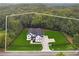 Aerial view of a new construction home in a wooded neighborhood with ample backyard space at 3165 Hall Rd, Dacula, GA 30019