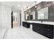 Elegant bathroom with dual vanities, chic lighting, and glass enclosed shower at 3165 Hall Rd, Dacula, GA 30019