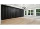 Bright bedroom with striking accent wall, recessed lights, and natural light from large windows at 3165 Hall Rd, Dacula, GA 30019