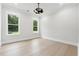 Neutral bedroom with large windows offering plenty of natural light and backyard views at 3165 Hall Rd, Dacula, GA 30019