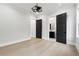 Neutral bedroom offering ensuite bathroom access and natural light from surrounding windows at 3165 Hall Rd, Dacula, GA 30019