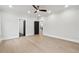 Spacious bedroom featuring neutral walls and hardwood floors, illuminated by recessed lighting and a modern ceiling fan at 3165 Hall Rd, Dacula, GA 30019