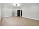 Spacious bedroom with hardwood flooring, white walls, recessed lighting, and a large walk-in closet at 3165 Hall Rd, Dacula, GA 30019