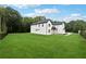 A modern home with a lush green lawn and fence, offering privacy and curb appeal at 3165 Hall Rd, Dacula, GA 30019