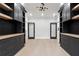 Symmetrical home office with light-colored wood floors, abundant storage, and recessed lighting at 3165 Hall Rd, Dacula, GA 30019