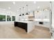 Bright kitchen featuring a large island with seating, modern appliances, and ample counter space at 3165 Hall Rd, Dacula, GA 30019