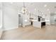 Open kitchen design featuring a large island, ample counter space, and abundant natural light at 3165 Hall Rd, Dacula, GA 30019