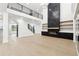 Open-concept living area with a fireplace, staircase and light hardwood floors at 3165 Hall Rd, Dacula, GA 30019