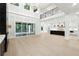 Open-concept living space with soaring ceilings, chef's kitchen, and hardwood flooring at 3165 Hall Rd, Dacula, GA 30019