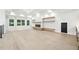 Bright living room with hardwood floors, modern fireplace, floating shelves, and large windows at 3165 Hall Rd, Dacula, GA 30019