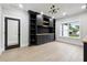 Office with built-in bookshelves, storage cabinets, hardwood floors, and natural light at 3165 Hall Rd, Dacula, GA 30019