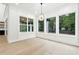 Bright sunroom with large windows offering abundant natural light and serene outdoor views at 3165 Hall Rd, Dacula, GA 30019