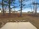 View of the backyard, showcasing the trees and landscaping at 40 Zebulon Pl, Covington, GA 30016