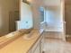 Bathroom features double sink vanity, soaking tub and separate shower at 40 Zebulon Pl, Covington, GA 30016