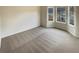 Spacious bedroom with a carpeted floor and large windows for natural light at 40 Zebulon Pl, Covington, GA 30016